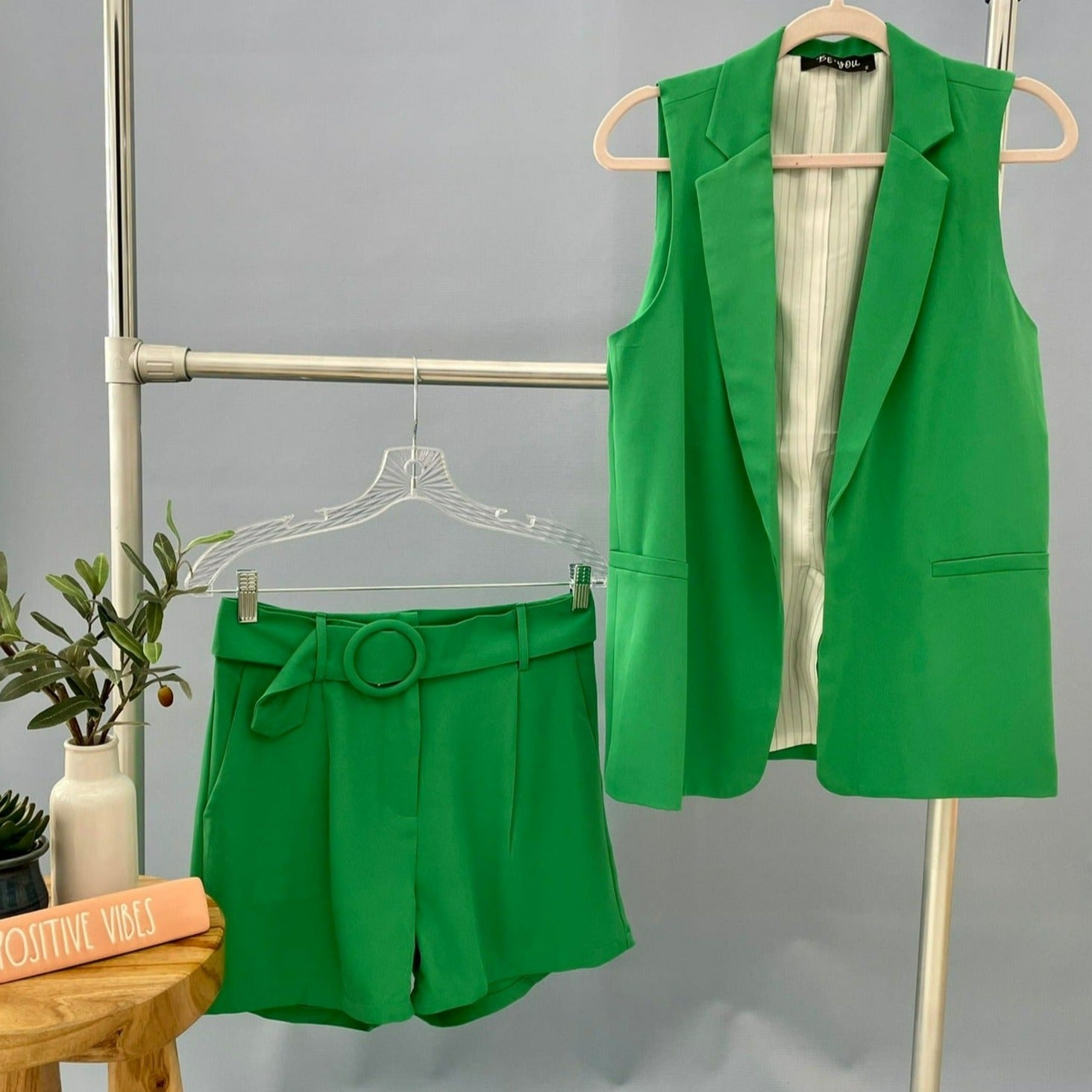 green vest and short set