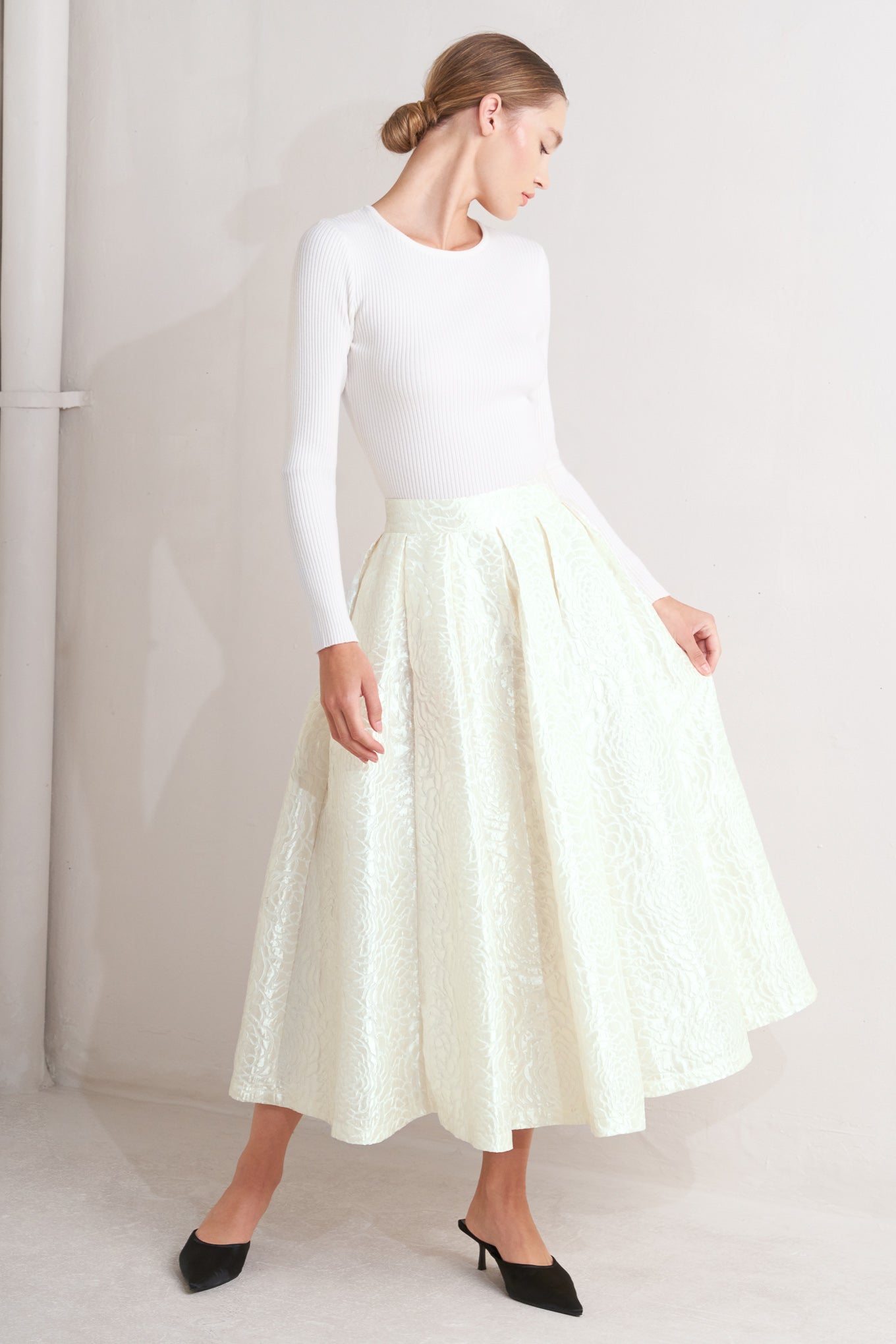 Ivory textured jacquard pleated midi skirt with high waist and box pleats