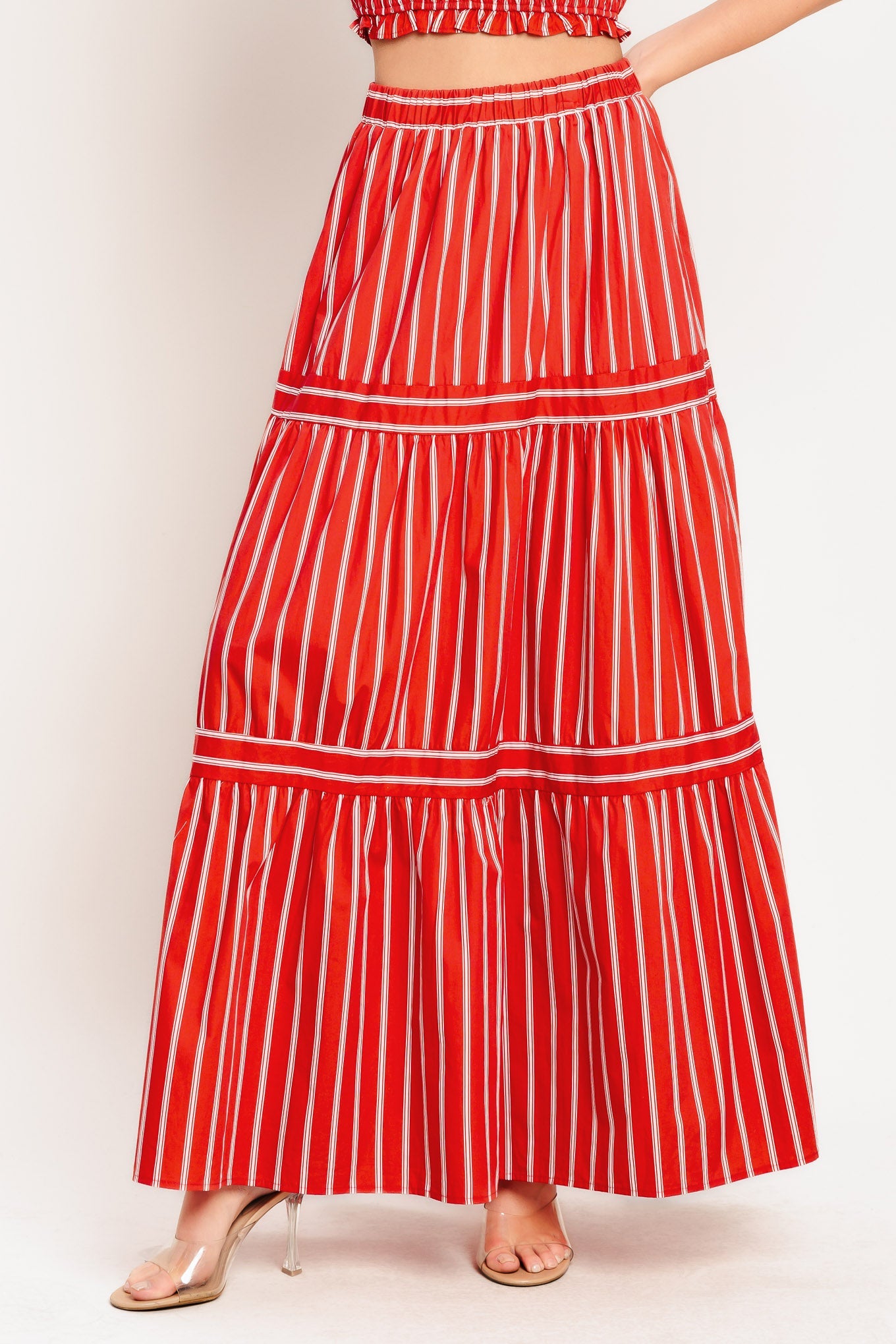 Red and white striped skirt on a plain background