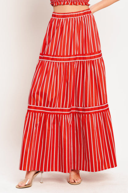 Red and white striped skirt on a plain background