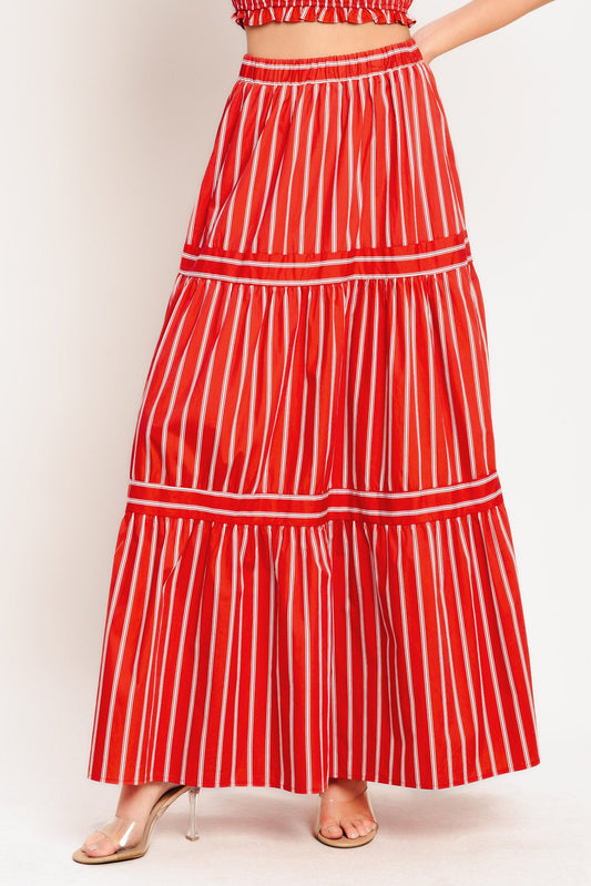 Red and white striped skirt on a plain background
