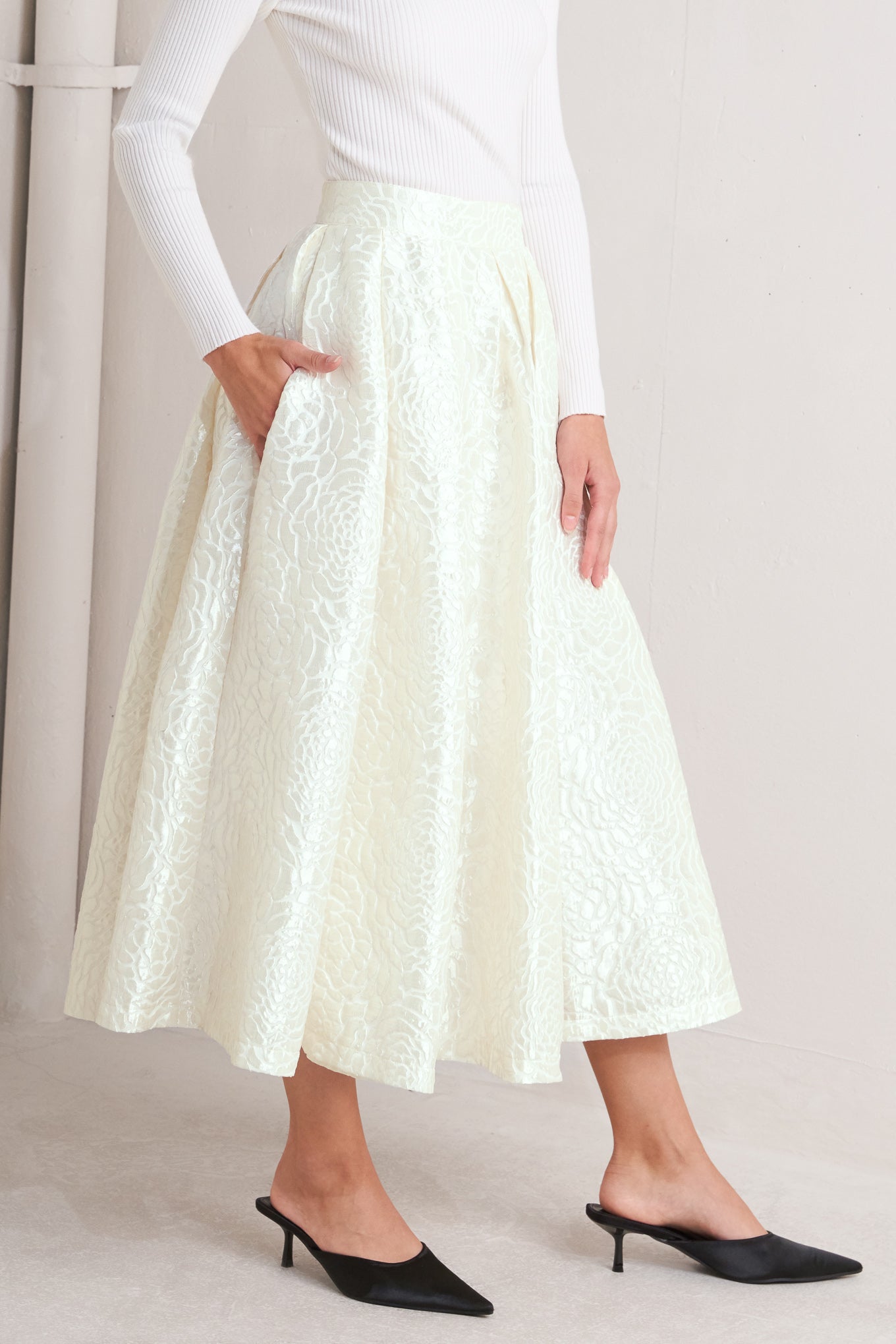 Ivory textured jacquard pleated midi skirt with high waist and box pleats