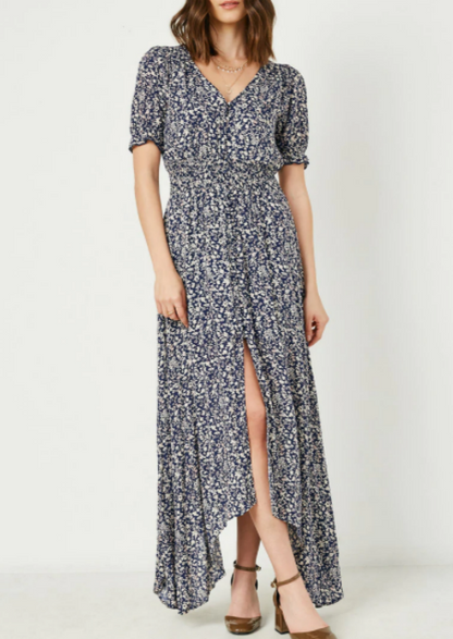 Navy floral maxi dress with a smocked stretch waistline and three-quarter sleeves, featuring a button-up front.